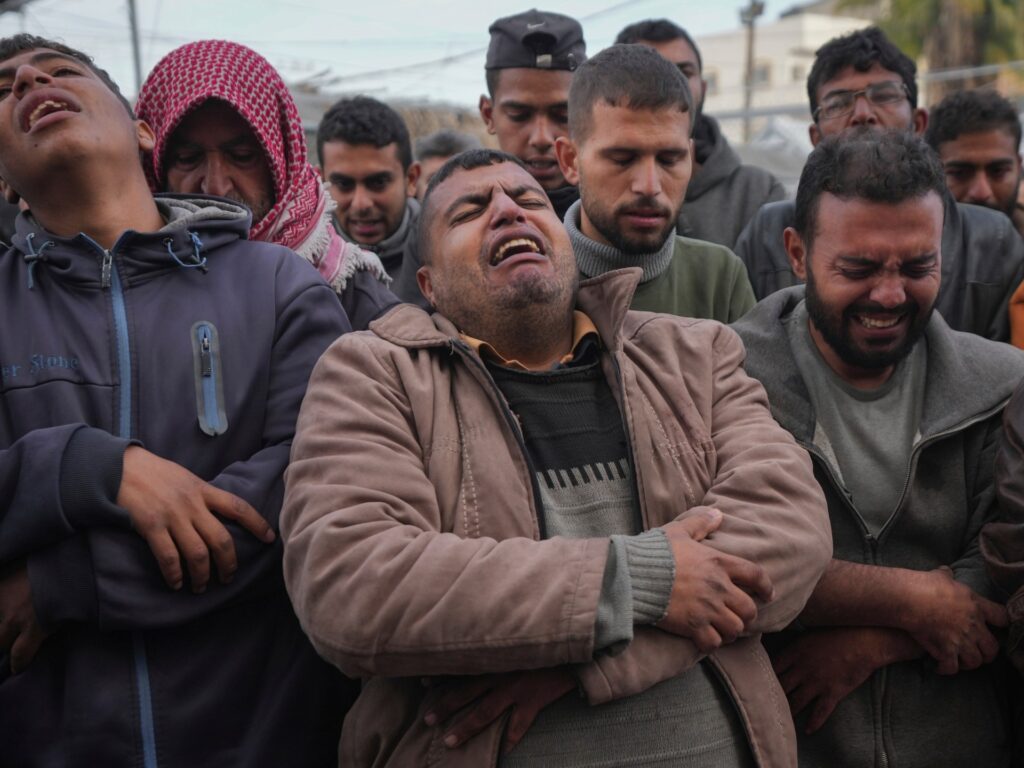 Israel kills 22 in Gaza, launches manhunt in West Bank after deadly attack