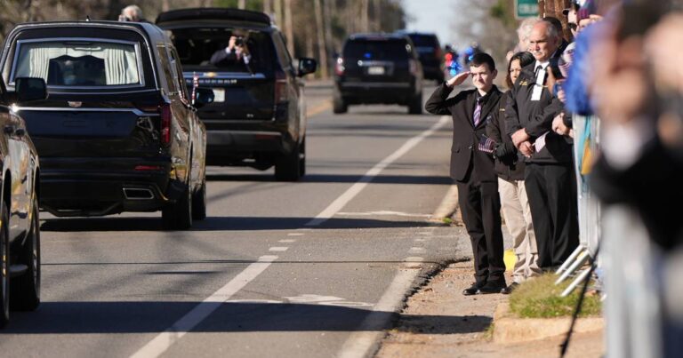 Jimmy Carter’s flag-draped casket is on its way to Atlanta as 39th president’s state funeral begins